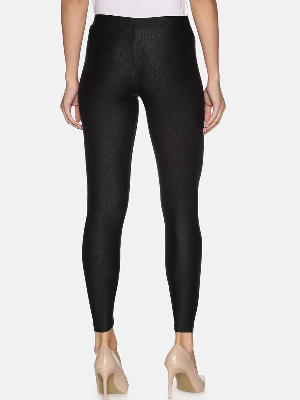 Black leggings worn by a person on a white background